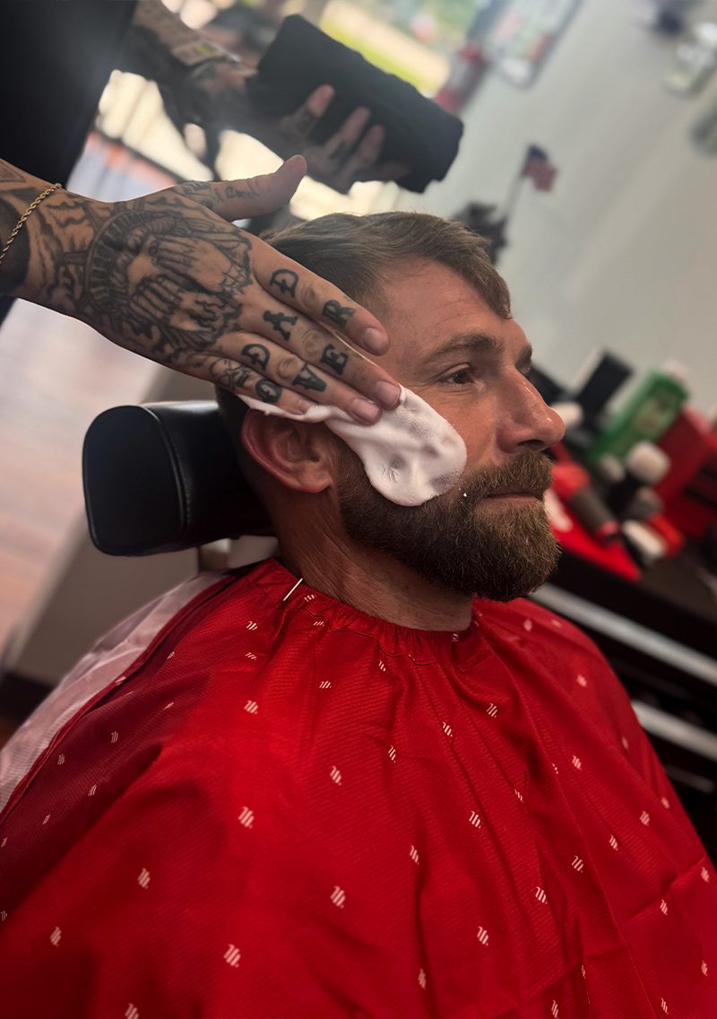 Hot-lather shave with a coral cape
